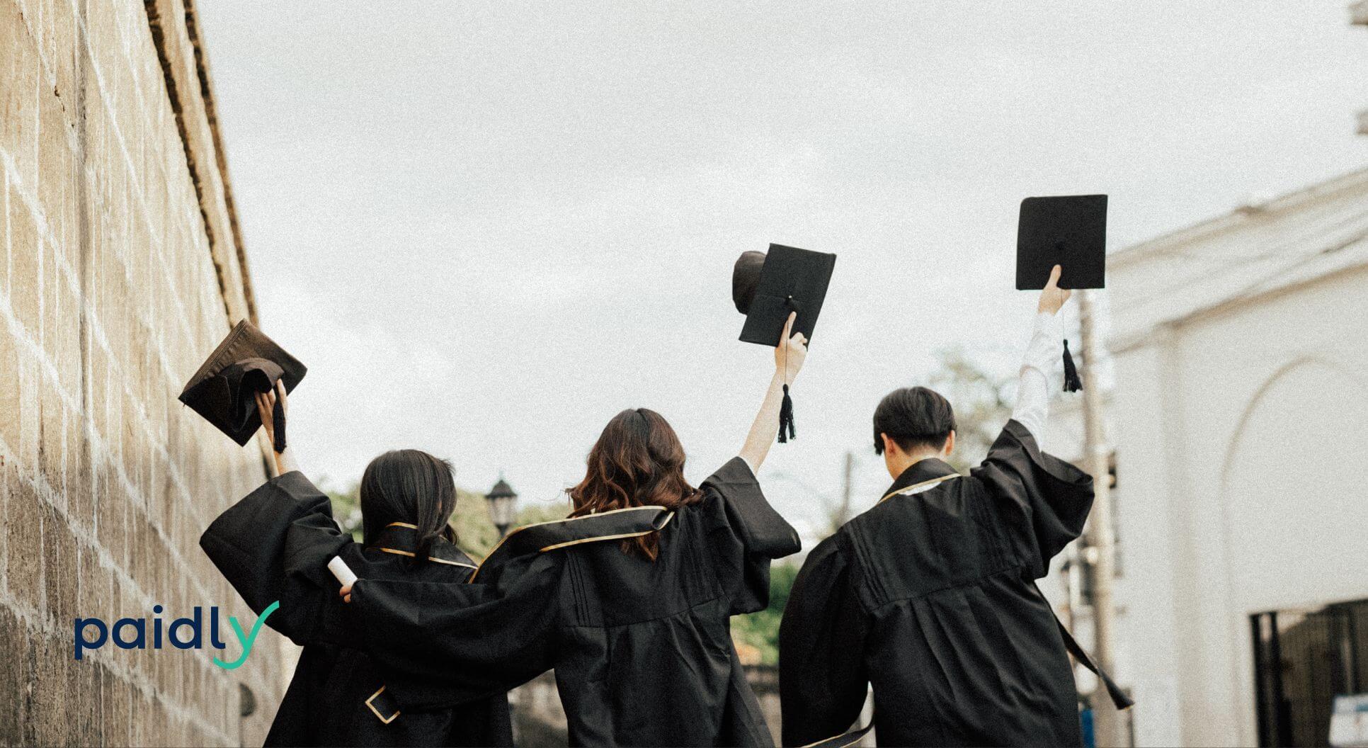 Graduates throwing their hats in the air