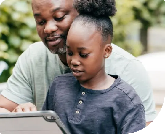 Father and Daughter Using Tablet