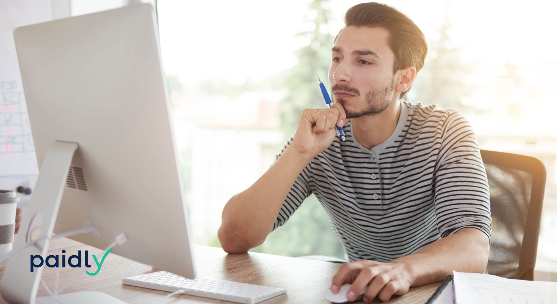 Student Loan Changes? 6 Steps to Protect Yourself A student thinking about their student loans at a computer